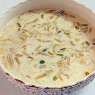 sheer khurma in a bowl with dry fruits topping