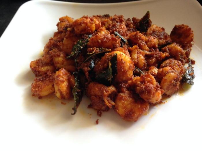 prawn fry on a plate with curry leaves as topping 