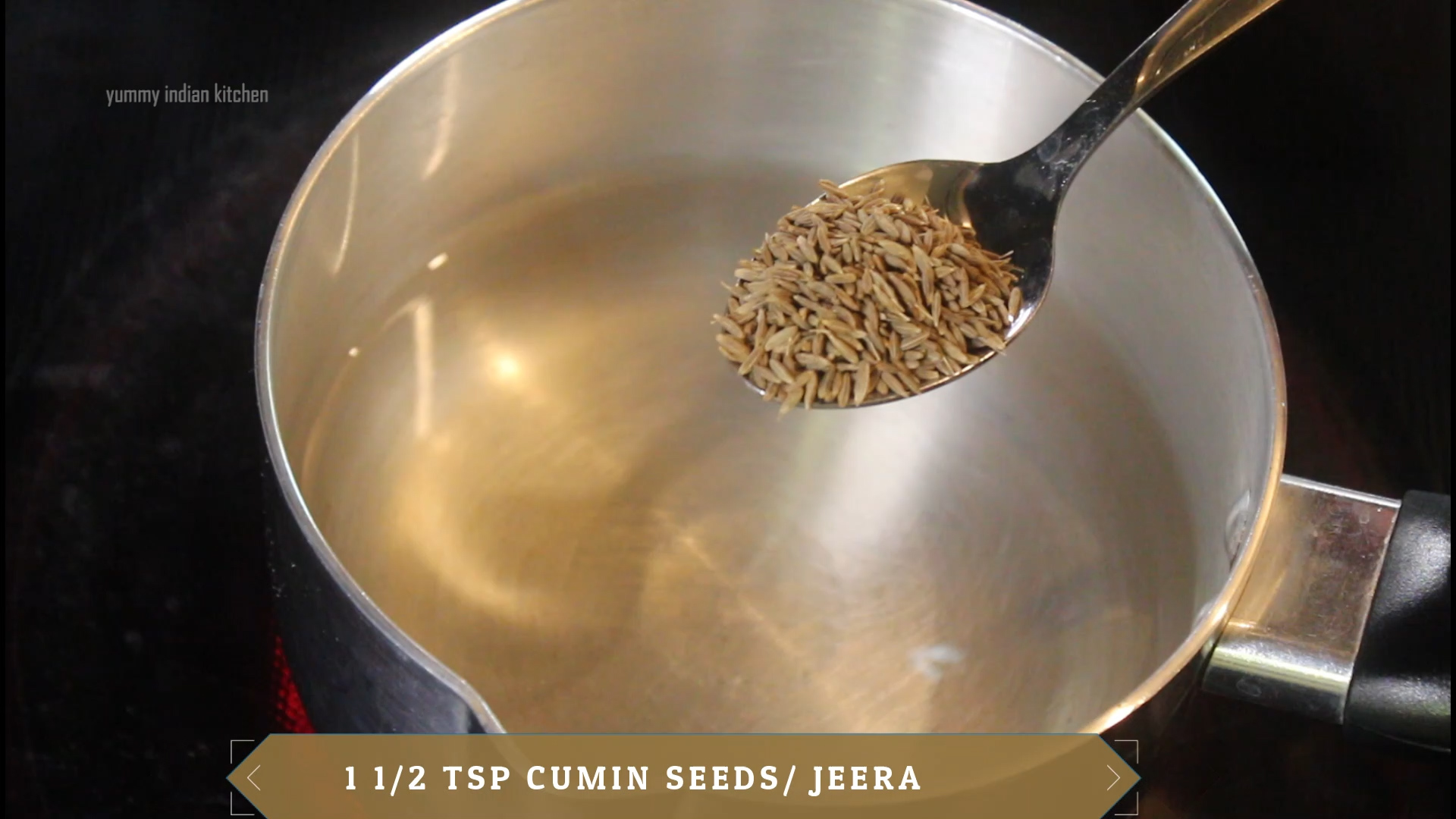 adding cumin seeds in a sauce pan with water