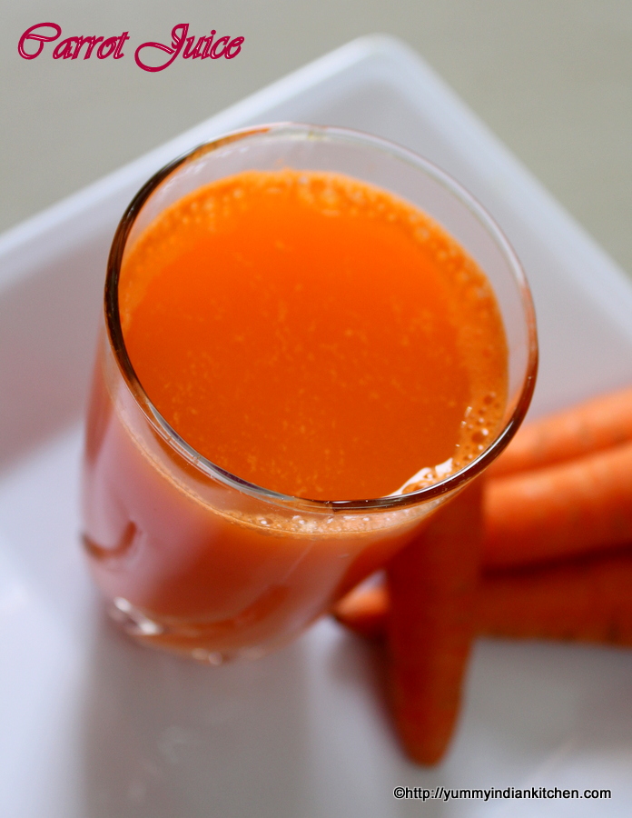 serving carrot juice in a glass with some carrots on a plate