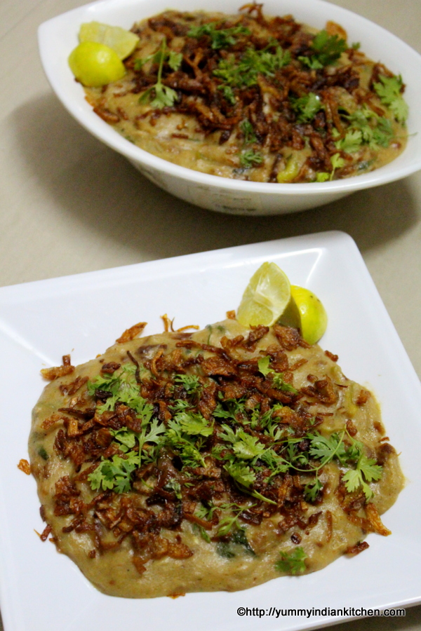 haleem recipe served in a bowl with fried onions as topping