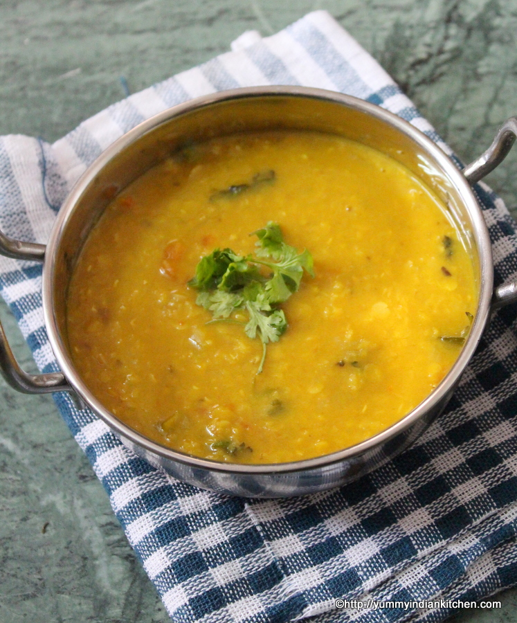 masoor dal recipe served in wok with coriander garnish