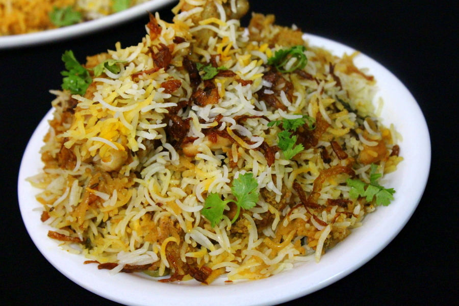 eid special chicken biryani served on a plate