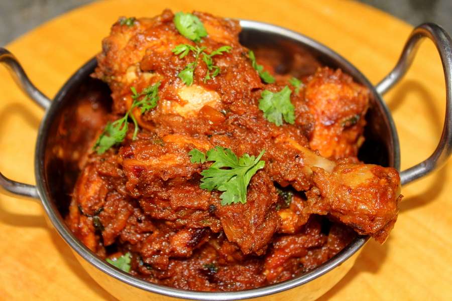 Chicken masala served in a small wok