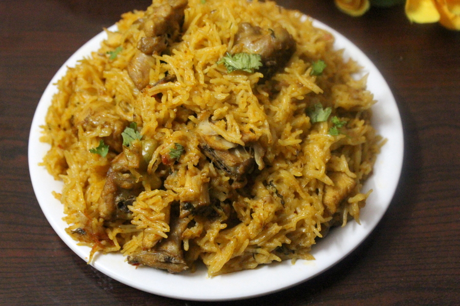 chicken biryani in cooker in a plate