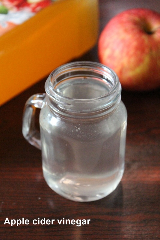apple cider with water in a glass jar to drink