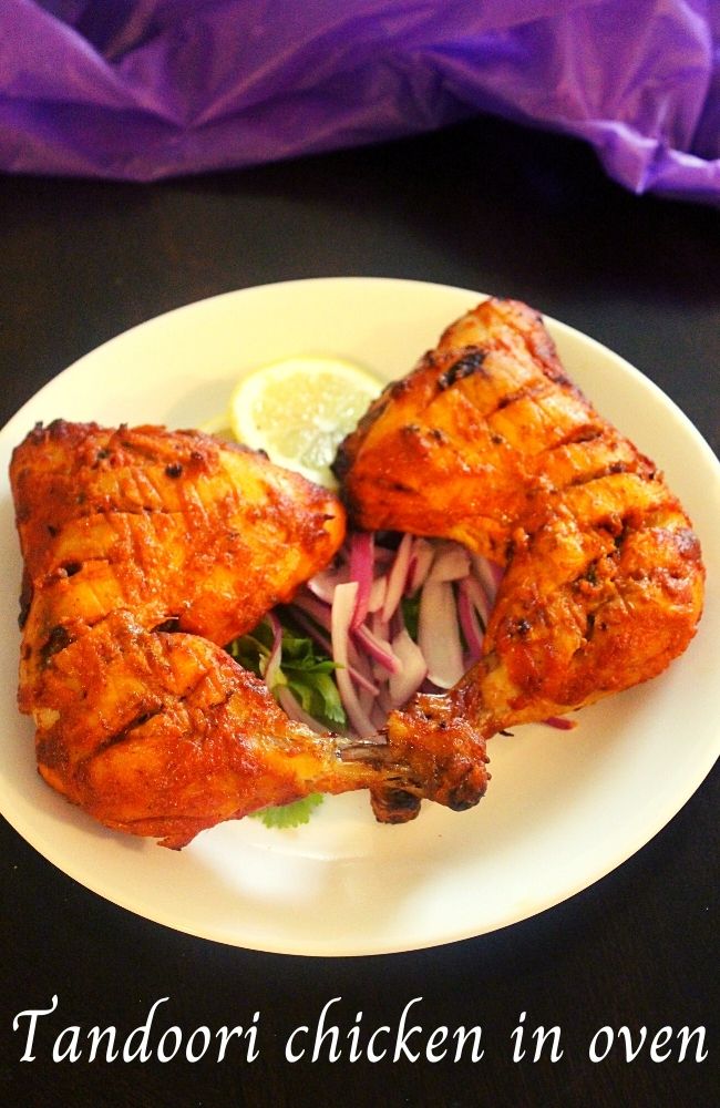 tandoori chicken garnished with onions and lemon