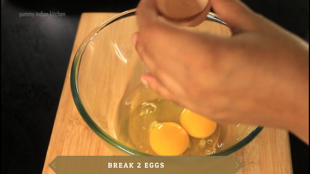 breaking two eggs.