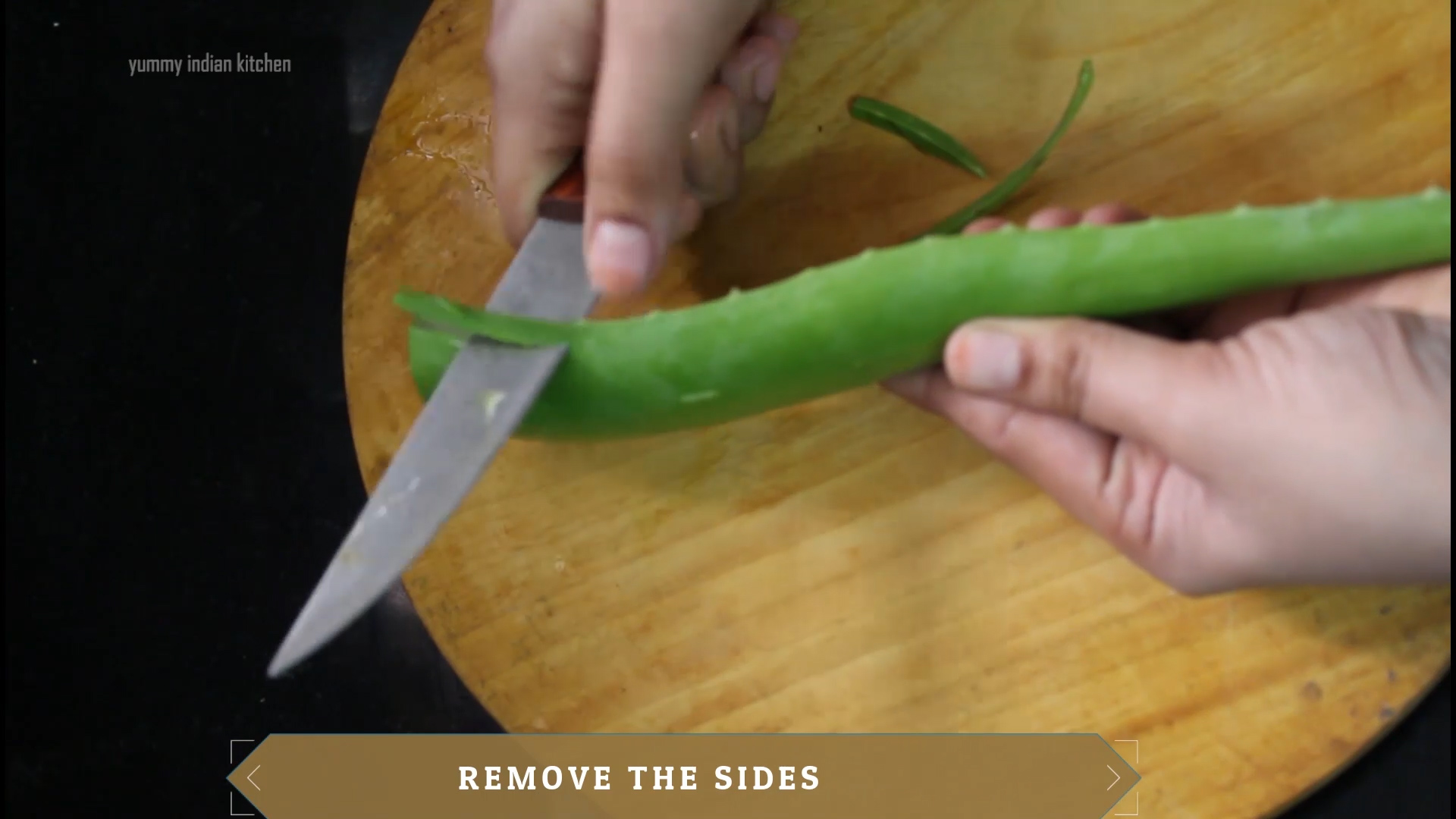 removing the edges of the aloe leaf