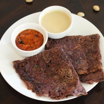 ragi dosa served on a plate with chutney in small bowls