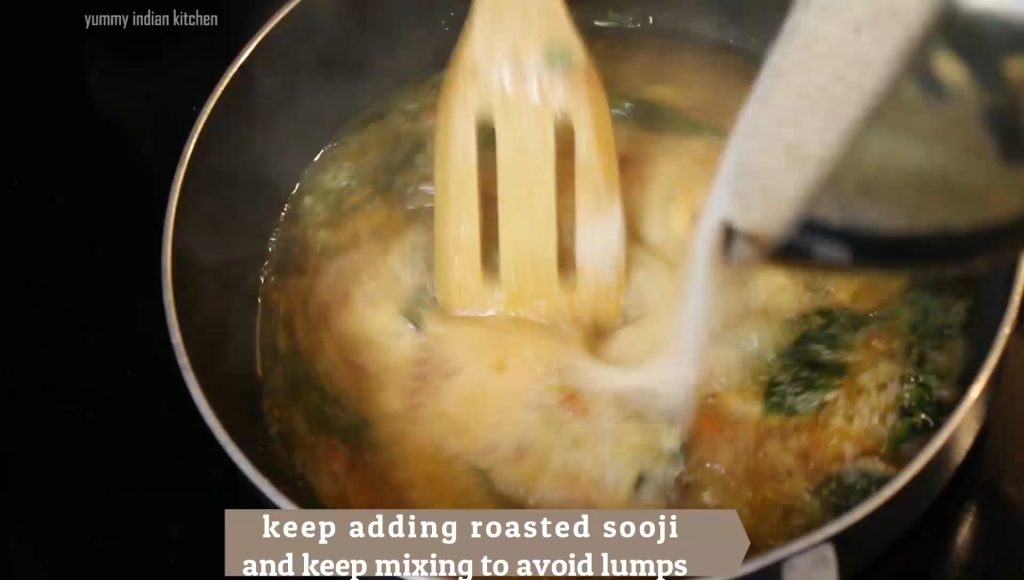 Adding roasted sooji by stirring 