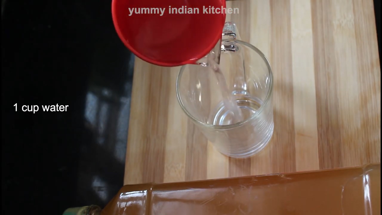 pouring water in a glass to make apple cider vinegar for weight loss