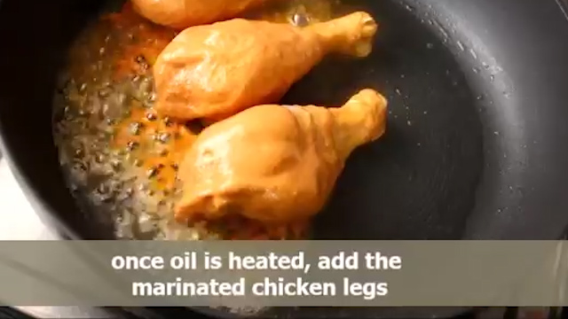 Dropping the marinated chicken legs 