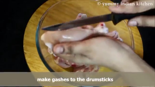 making gashes to all the chicken drumsticks