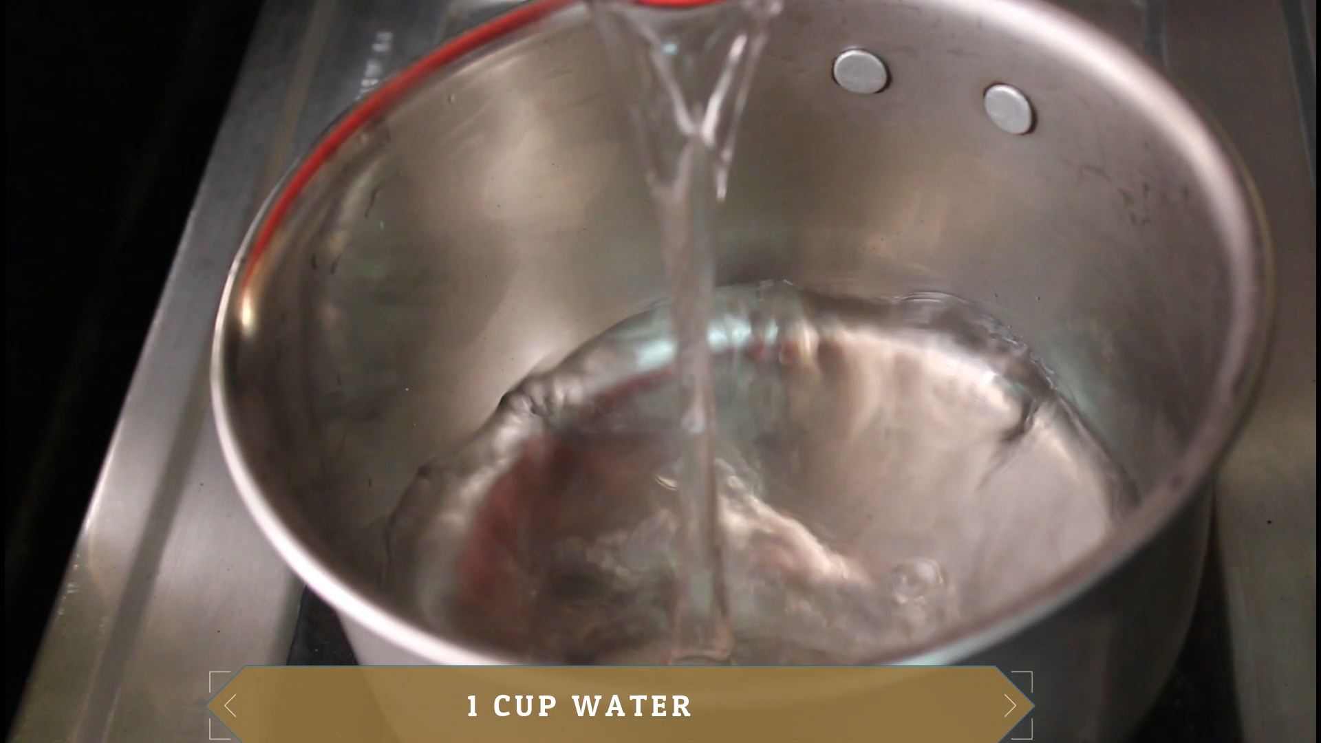 pouring water into a saucepan