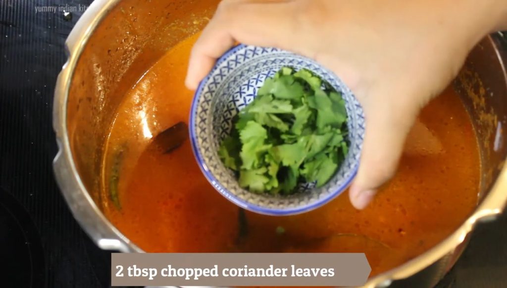 Adding chopped coriander leaves.