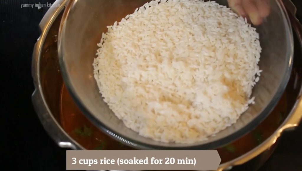 Adding the washed and soaked rice
