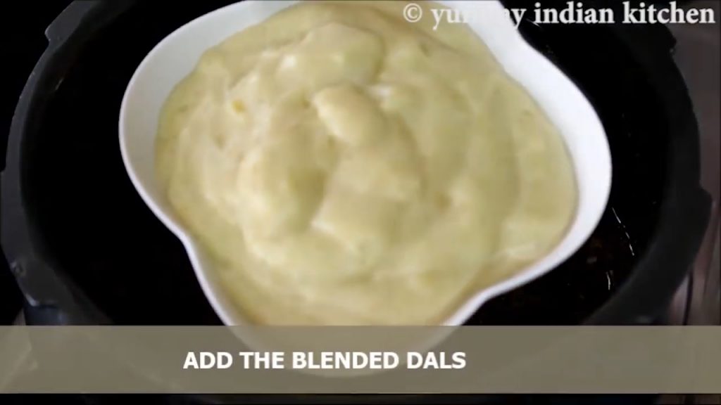 adding blended paste of dals to mix without lumps.