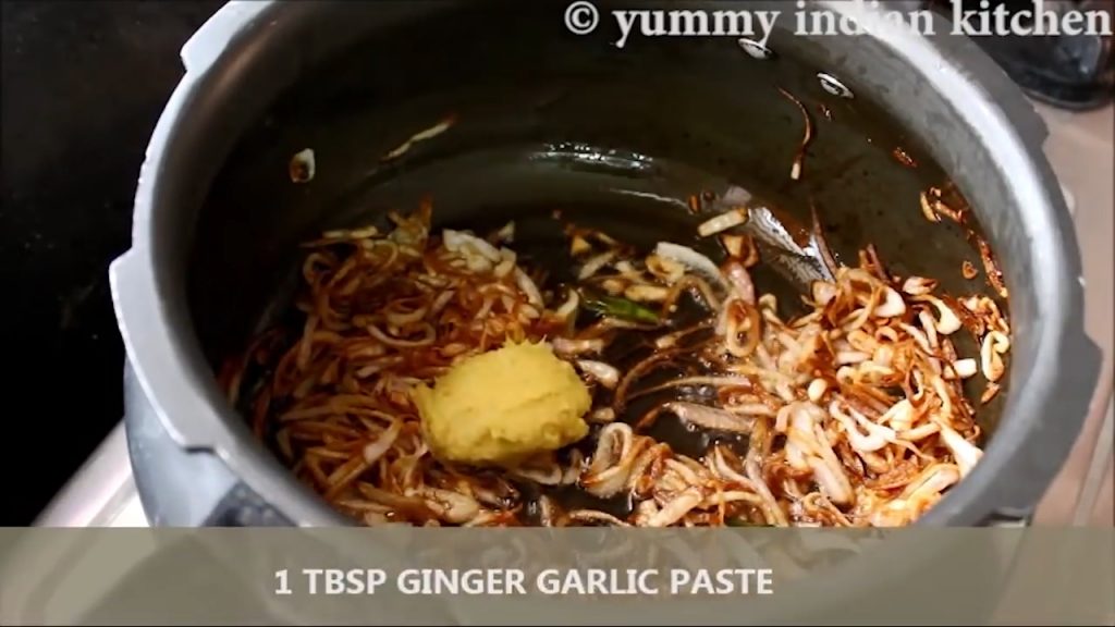 Adding ginger garlic paste