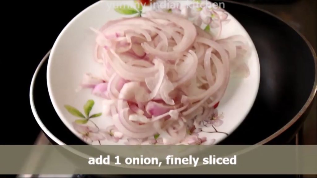Adding sliced onions into the pan
