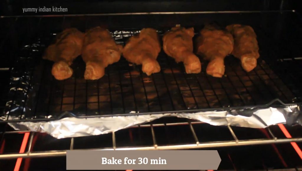 Placing the baking sheet into the oven, bake the chicken for 30 minutes
