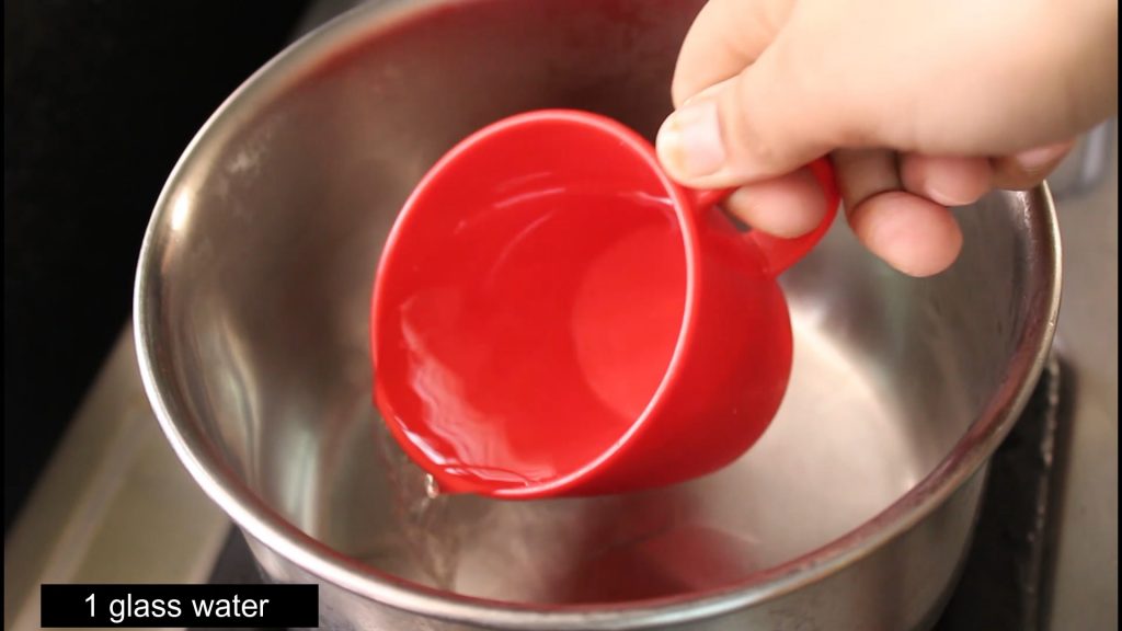 pouring water into the saucepan