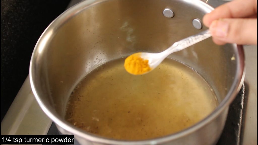 showing turmeric powder to add into the water