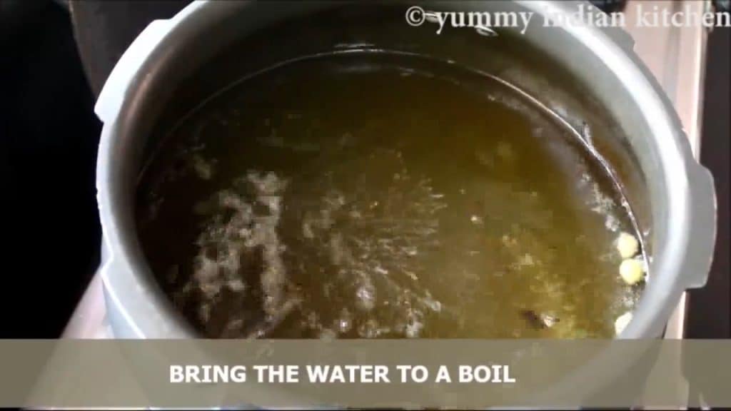 Adding caraway seeds and bringing the water to a boil