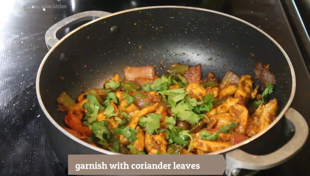 Garnish with chopped coriander leaves and serve the chicken jalfrezi