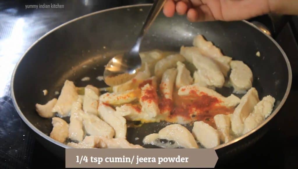 Adding cumin powder, black pepper powder