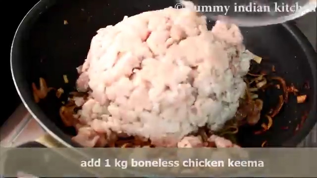Adding the boneless chicken keema into the wok
