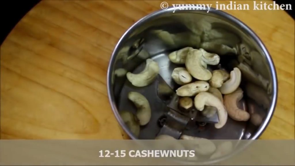 adding kaju/cashewnuts tp make a fine powder of them.