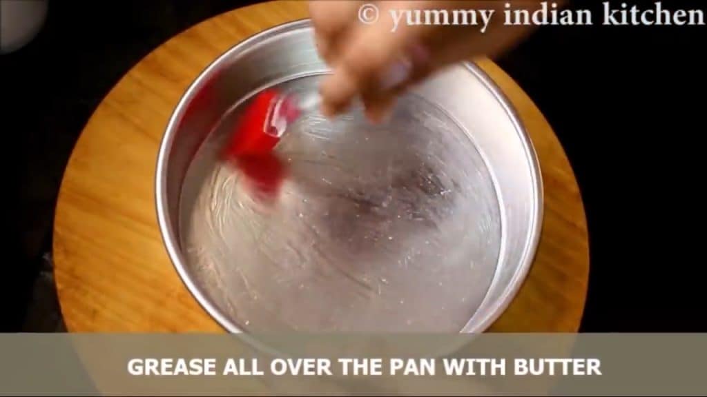 applying butter all over the pan and grease well.