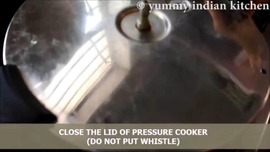 Cover the lid of the pressure cooker but do not use the whistle