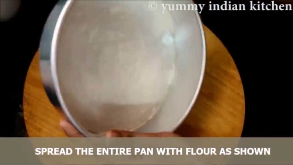 Covering the entire pan with flour