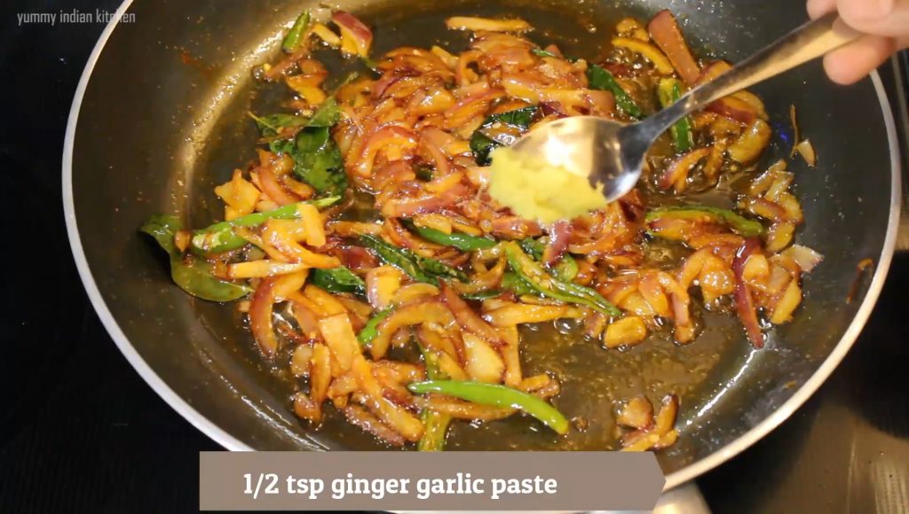 adding ginger garlic paste into the pan