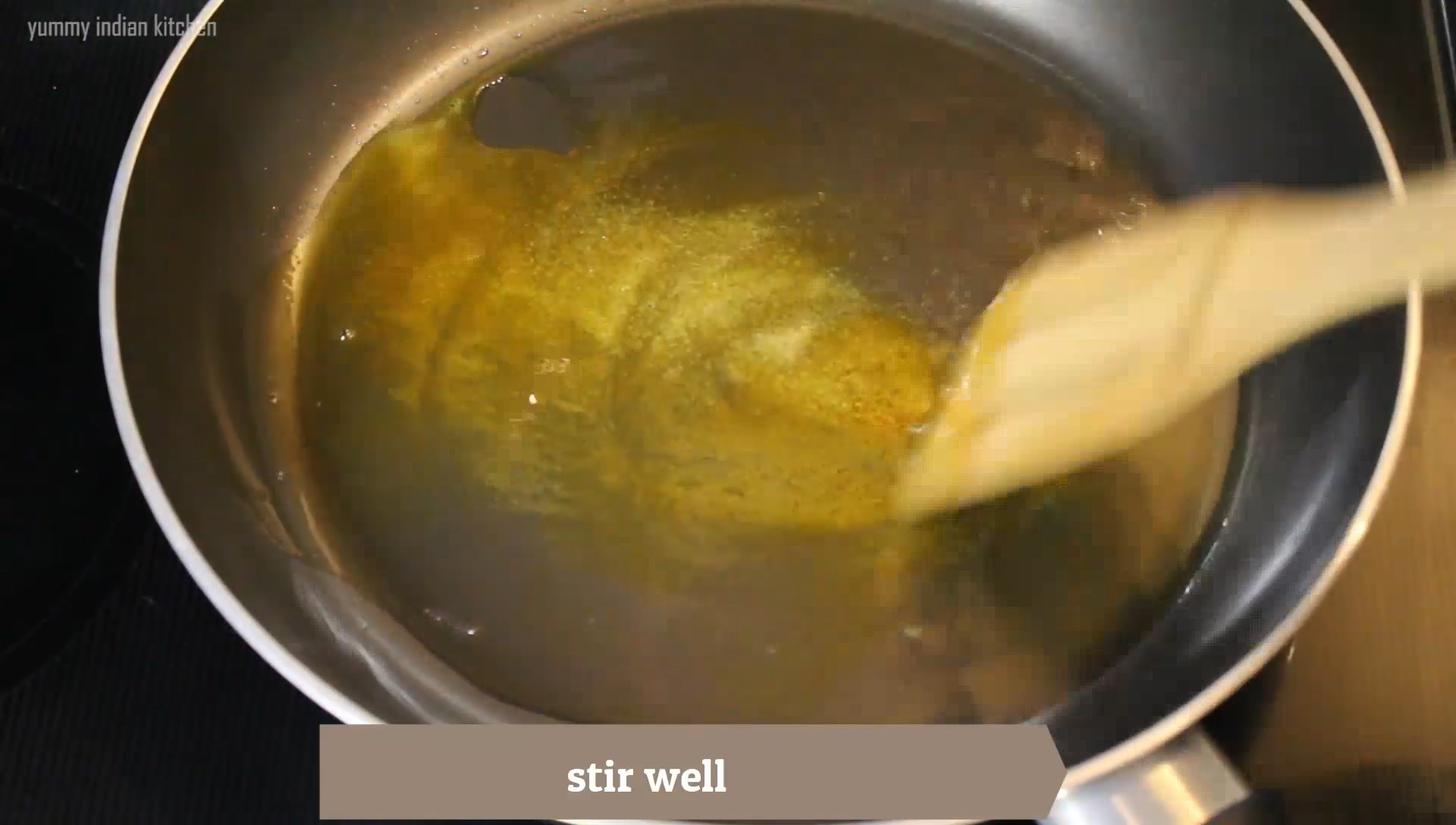 stirring the spices in the oil