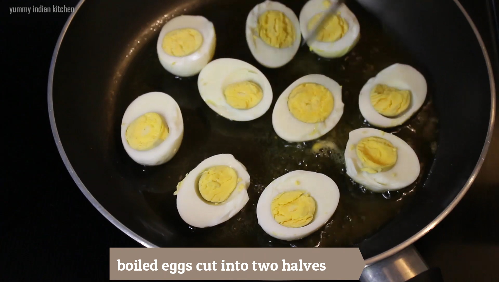stir fried the boiled eggs cut into halves