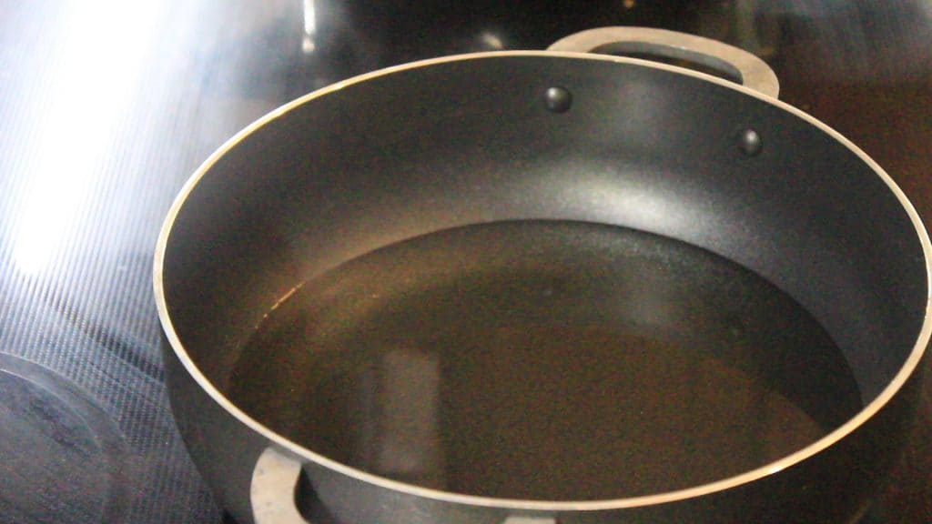 Heating oil in a pan or a wok 