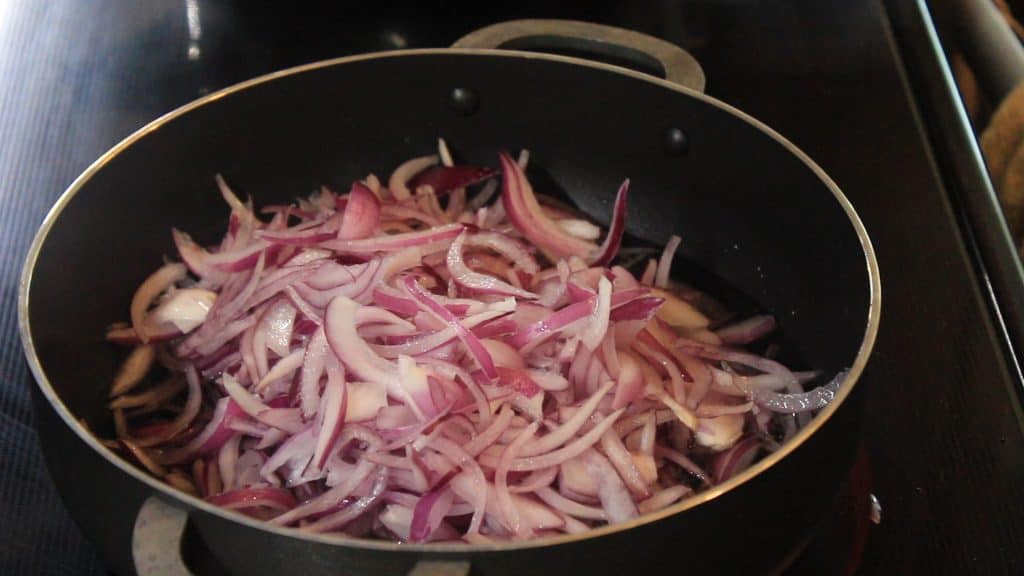 Adding all the onions for frying