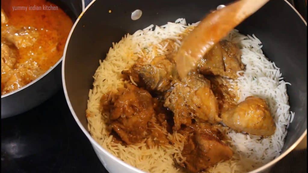 adding a layer of chicken curry