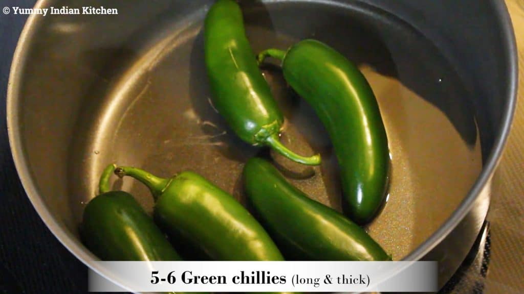 Adding the big green chillies.