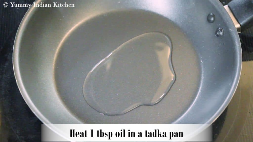 Taking a tadka pan, adding oil and heating it