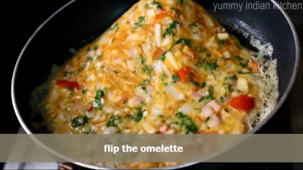 flipping the masala omelette 