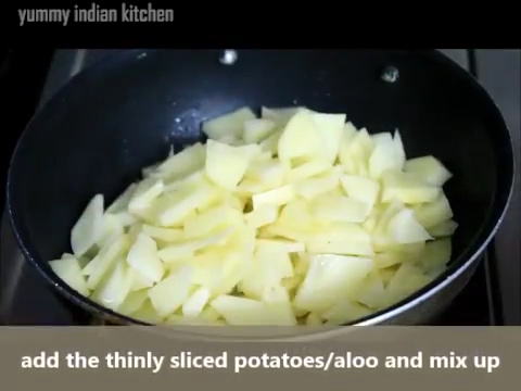Adding the sliced aloo/potatoes 