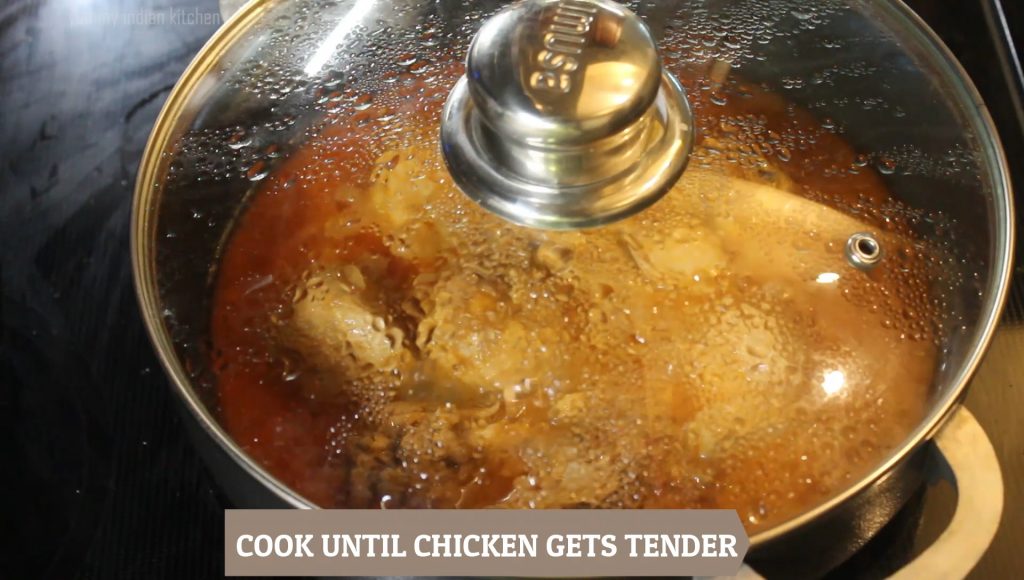 Mixing the punjabi chicken well
