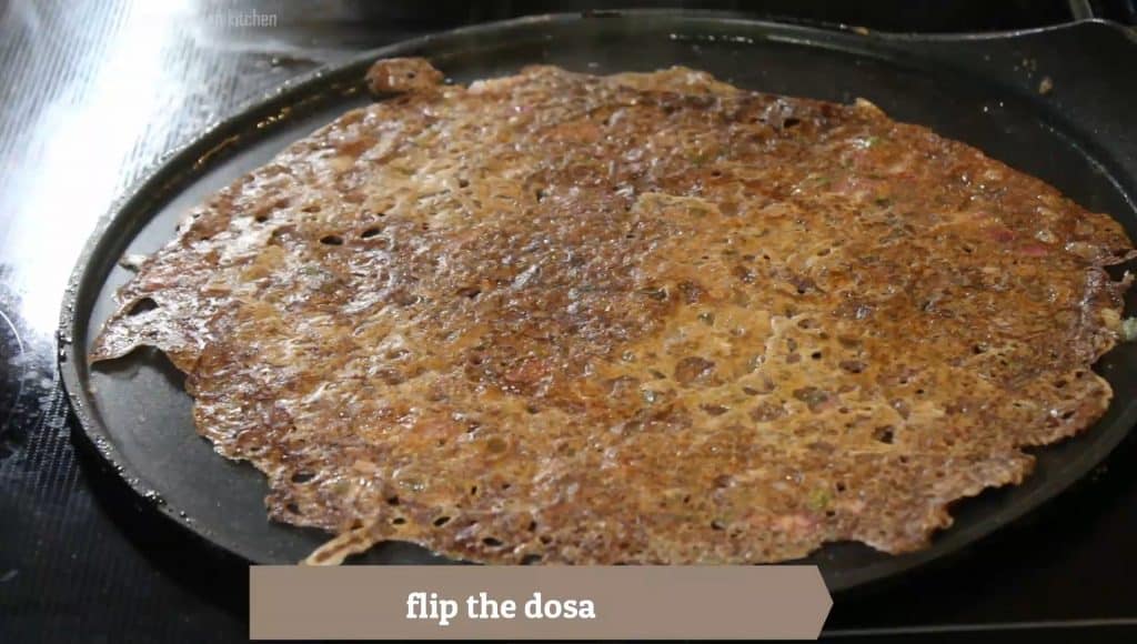 Flip the instant ragi dosa very carefully 