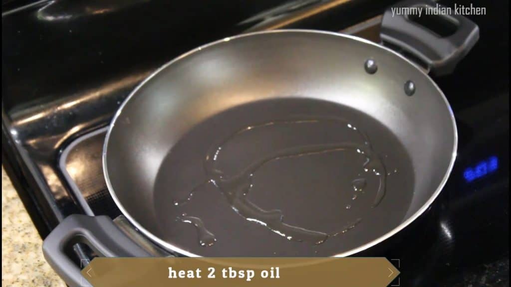 Adding 2 tablespoon of oil and heating it