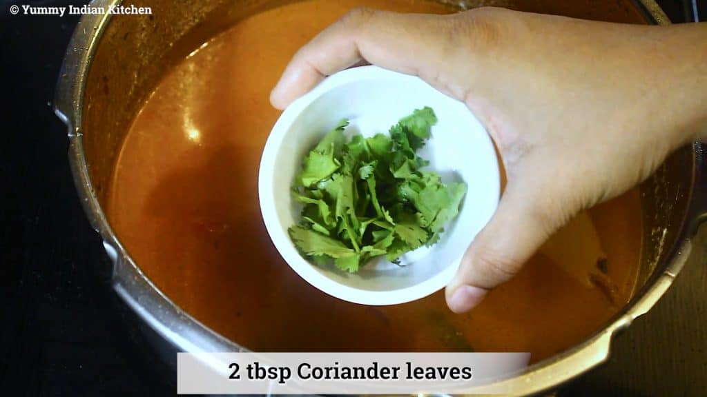 Add coriander leaves, mint leaves, to tomato rice biryani