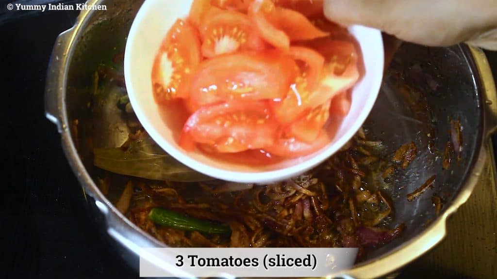 Adding sliced tomatoes